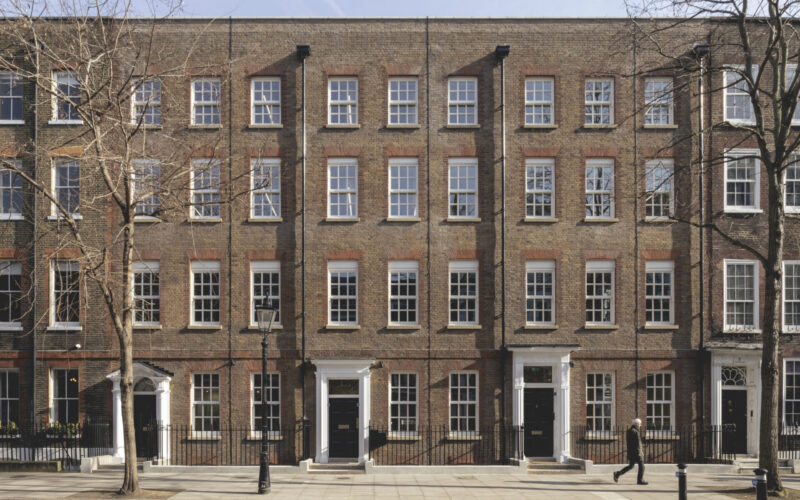 A row of Georgian office buildings in London featuring their original facades