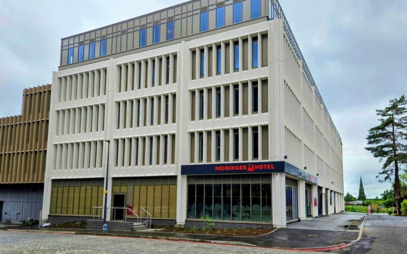Exterior of a fairly low rise hotel building in Edinburgh featuring lots of windows