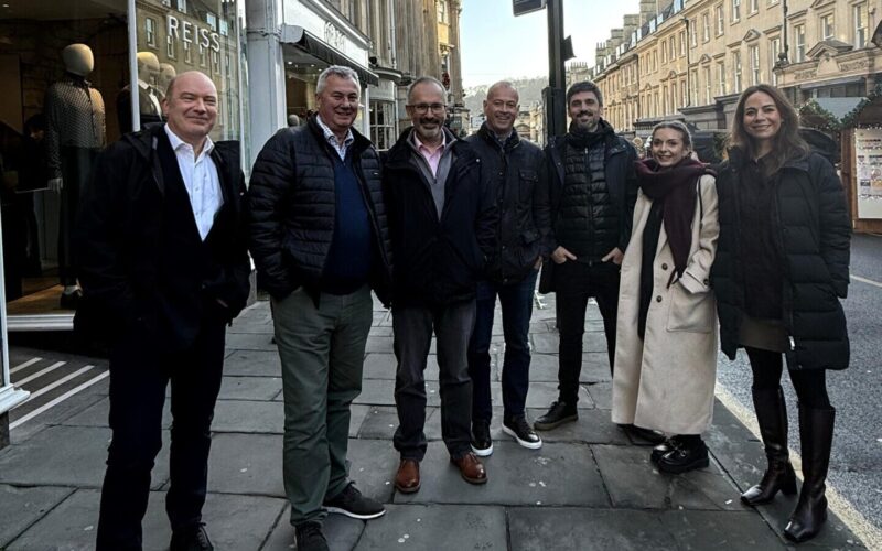 A group of men and women stood on the pavement in Bath city centre