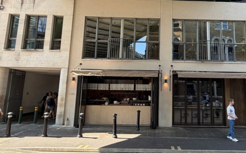 Exterior of a building featuring retail space on the ground floor