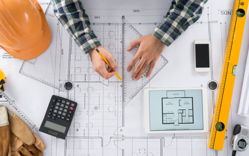 Engineer,Using,Set,Square,To,Draw,A,Line,On,The