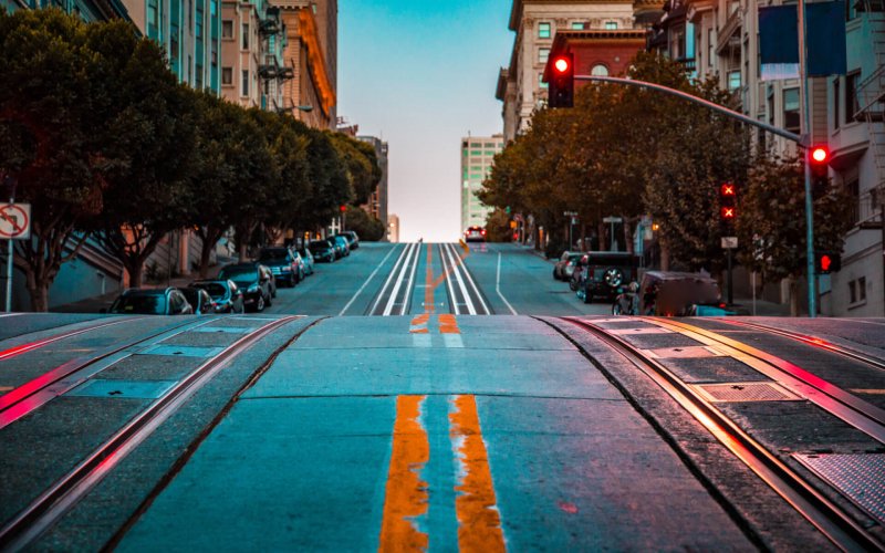Low,Angle,Twilight,View,Of,An,Empty,Road,With,Cable