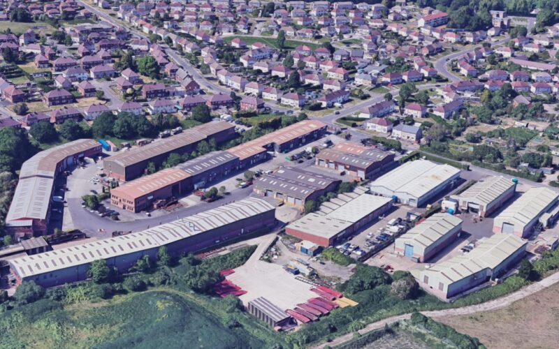 Aerial view of an industrial estate surrounded by housing
