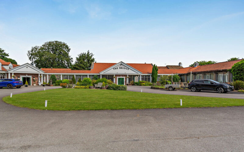 The Bridge Hotel in Wetherby with a large lawn area at the front of the property