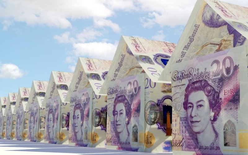 A,Concept,Of,Pound,Bank,Notes,Folded,Into,The,Shape