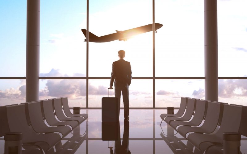 Businessman,In,Airport,And,Airplane,In,Sky