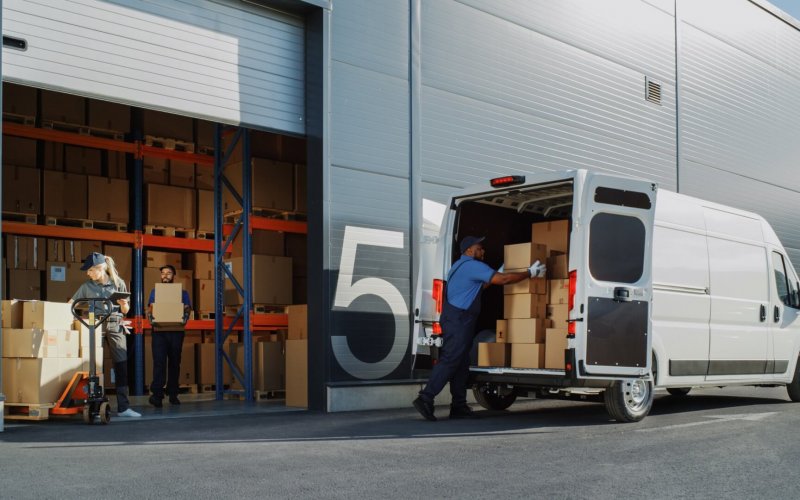 Outside,Of,Logistics,Retailer,Warehouse,With,Manager,Using,Tablet,Computer,