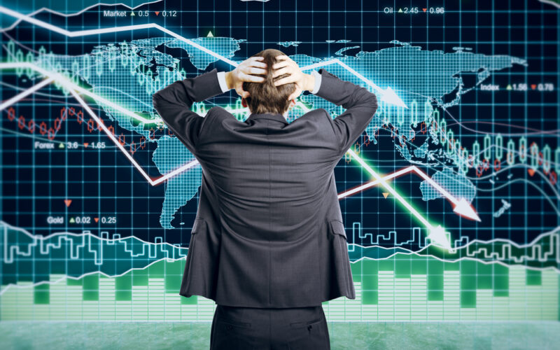 Businessman,Grabs,The,Head,Concept,With,Business,Chart,On,Scoreboard